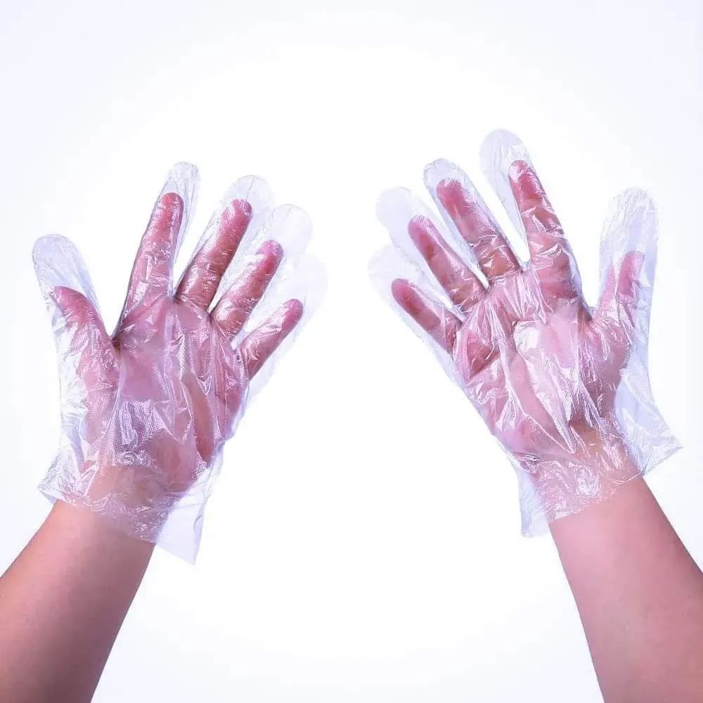 Disposable polythene gloves.
